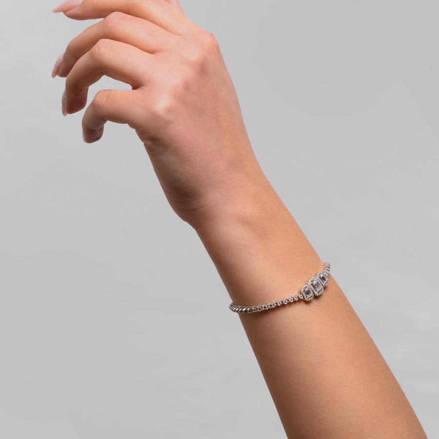 Imperia - Sophisticated Tennis Bracelet Featuring Central Emerald-Cut Lab Grown Diamond Stones in 18ct Gold