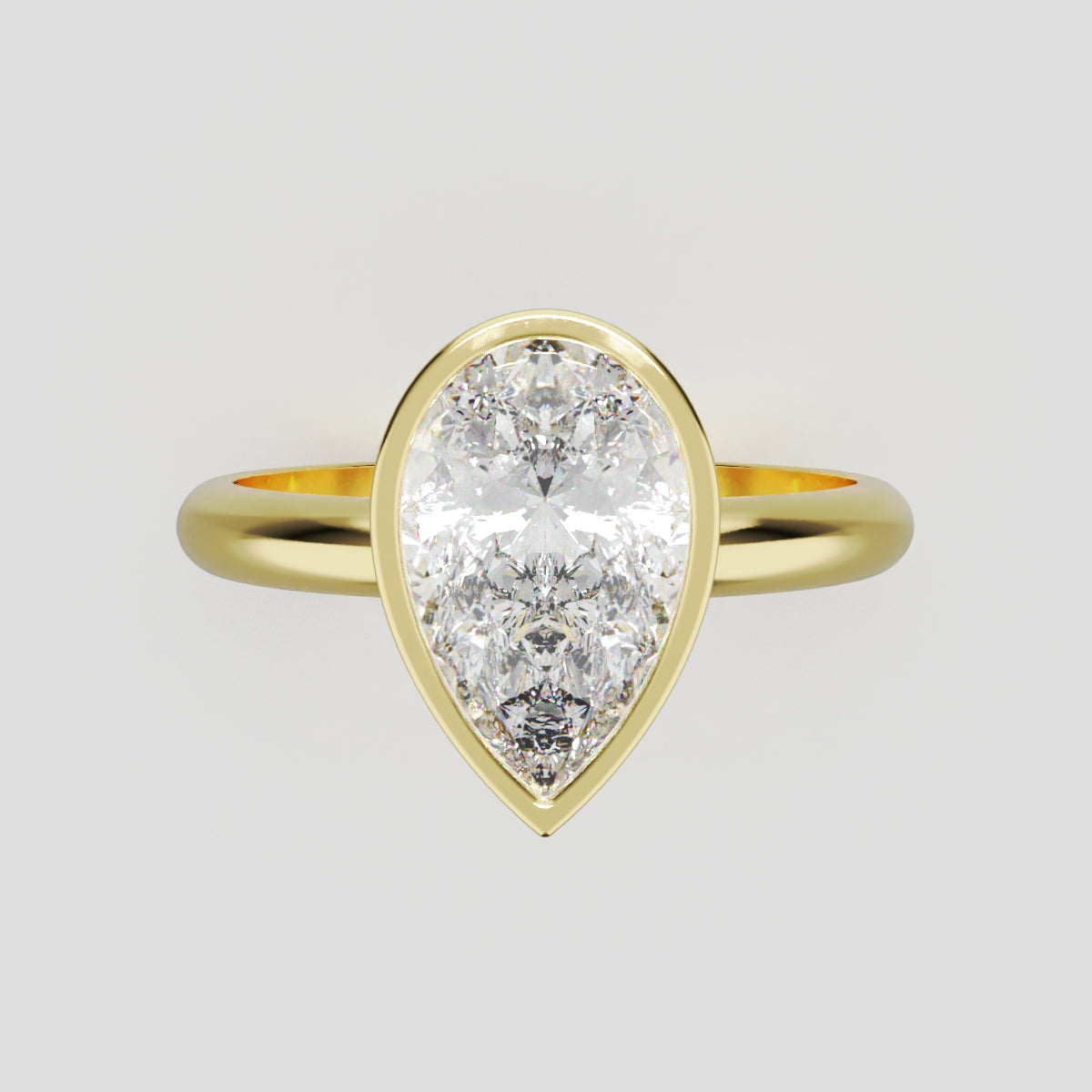 Scudo, 1.5ct pear lab grown diamond engagement ring, Bezel, 18K yellow gold - front view
